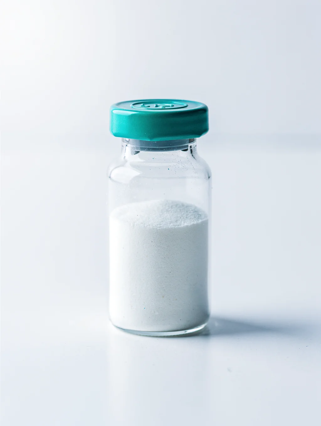 Analytical sample vial with sealed teal cap for laboratory identification